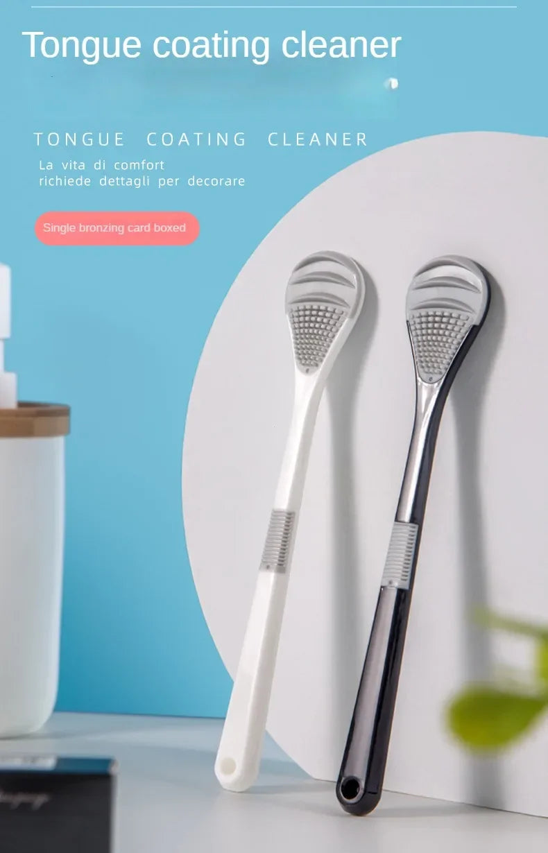 A white reusable tongue coating cleaner brush is shown against a light blue background.