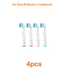 Four replacement brush heads for an Oral-B electric toothbrush.
