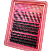 A pink tray of manga lash clusters showing different styles including bottom, daily, charmig, and dense looks.