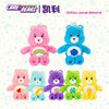 A collection of colorful Care Bears plush stuffed animals including pink, blue, purple, green, and yellow bears.