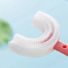 A white U-shaped silicone toothbrush is shown against a light blue background.
