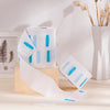 White hair dressing collars with blue stripes displayed on a wooden block.