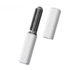 A white portable wireless hair comb and curling iron with a black comb attachment.