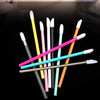 A collection of colorful disposable portable lip brushes and applicators displayed against a black background.
