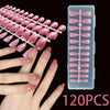 A set of 120 pink French ballet press-on nails displayed on a hand and in a clear plastic container.