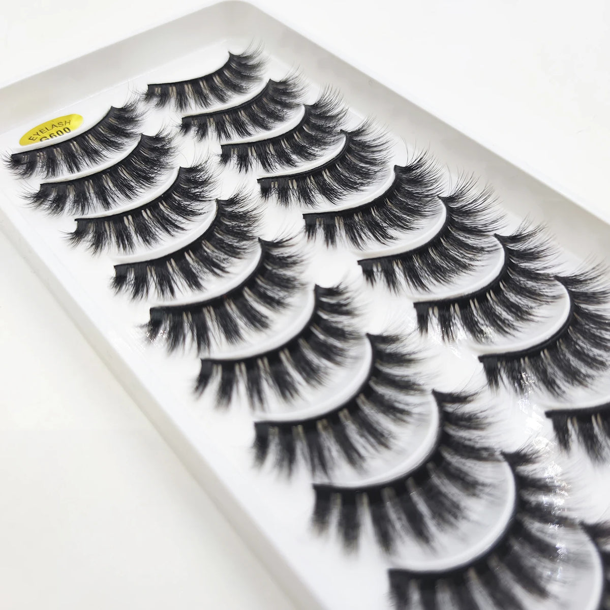 A display of natural 3D mink false eyelashes in various styles and lengths.