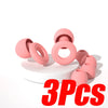 Three pink silicone earplugs are displayed on a white surface.