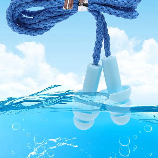 Blue braided cord with silicone earplugs submerged in clear blue water