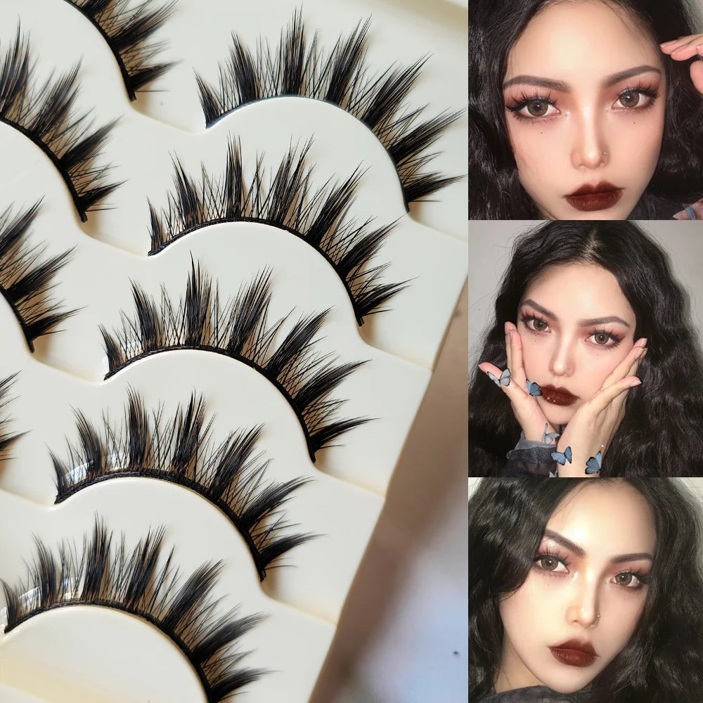 A collection of black Paris Cat Eye false eyelashes displayed on a white tray.