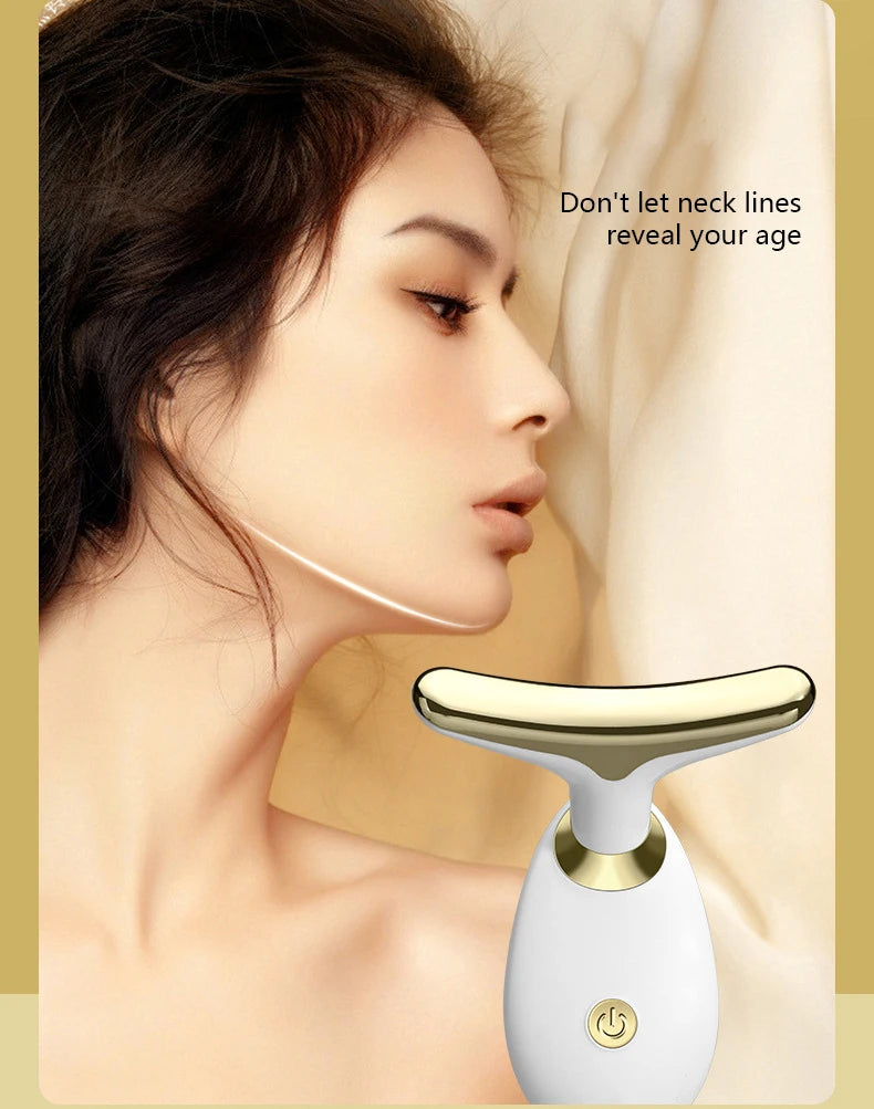 A close-up of a woman's face showing the application of an electric facial lifting and firming massager device.
