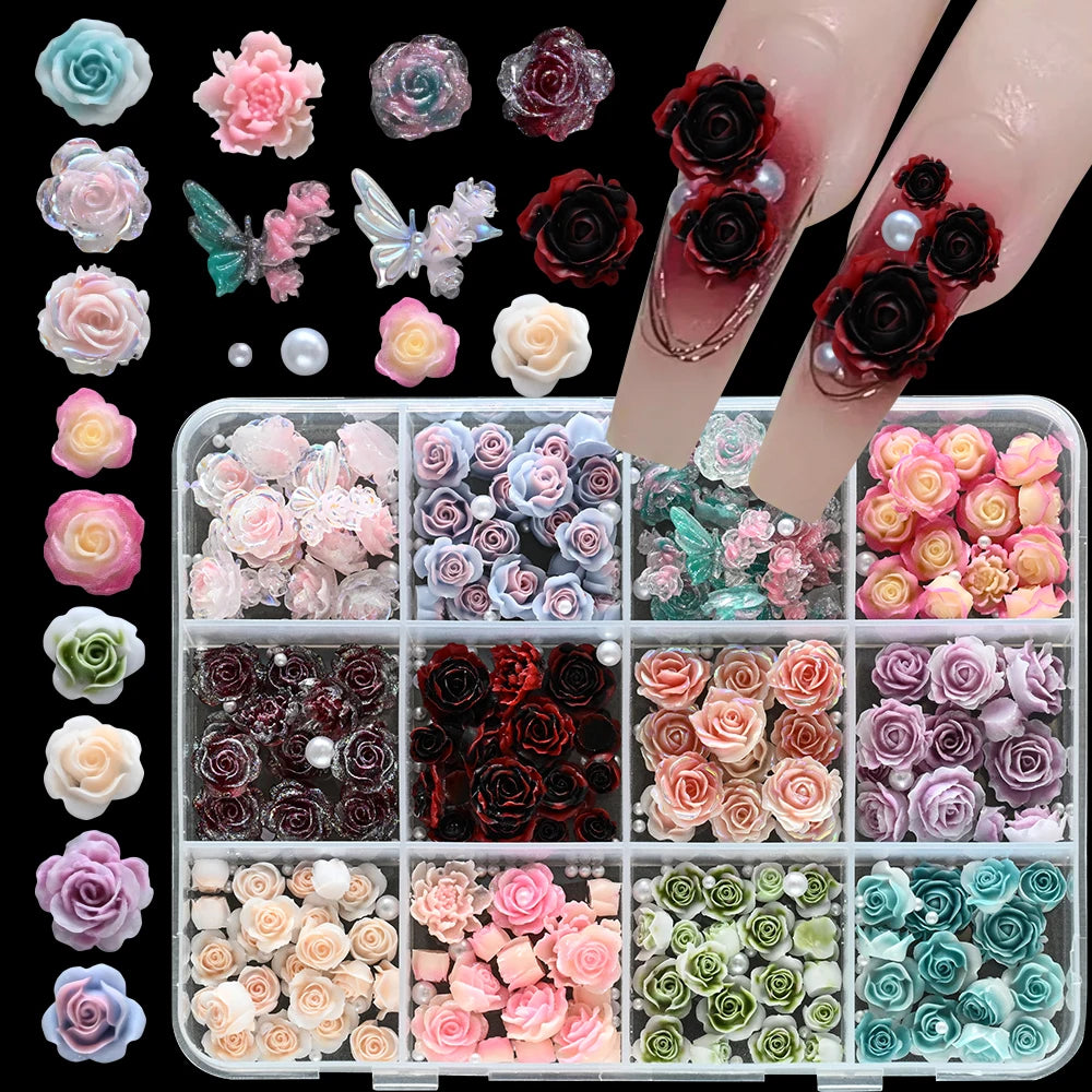A collection of 3D floral butterfly pearl nail art charms in various shades of pink, red, and green.