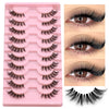 A pink plastic tray holding multiple pairs of clear band cat eye false eyelashes and a single lash strip.