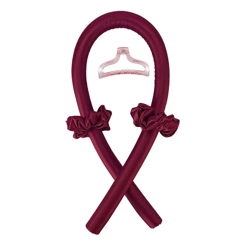 A deep burgundy satin heatless curling rod headband with a matching satin bonnet, crossed in an X shape.