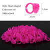 A pile of pink heart-shaped disposable glue rings for eyelash extensions and nail art