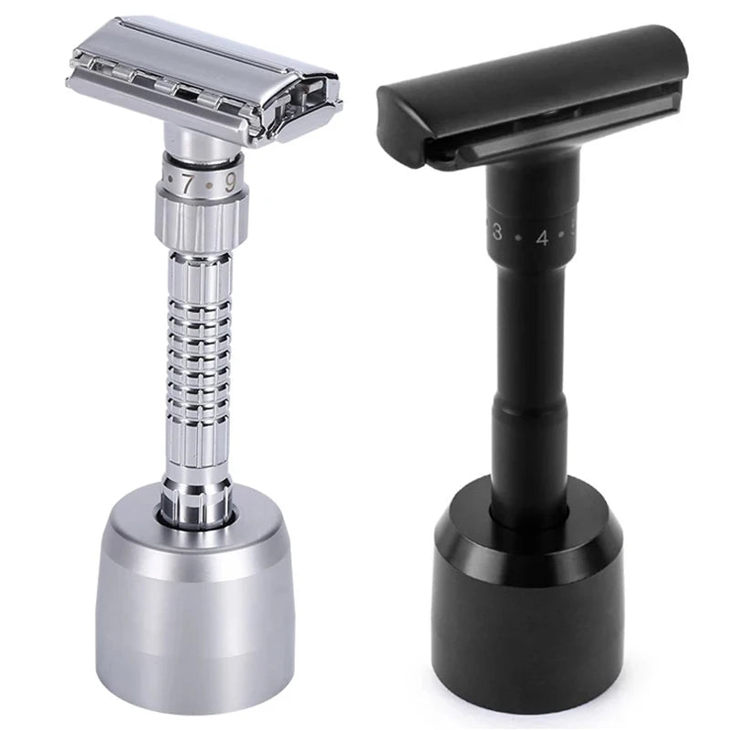 A silver and black double edge safety razor with a butterfly opening shown from the side.