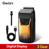 A black portable electric shaver with a gold accent and a digital display showing 99% power left.
