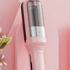 A pink automatic hair ends trimmer is shown against a light pink background.