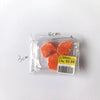 Un emballage plastique transparent contenant des morceaux de simulation de nourriture pour saumon pour maisons de poupées, av