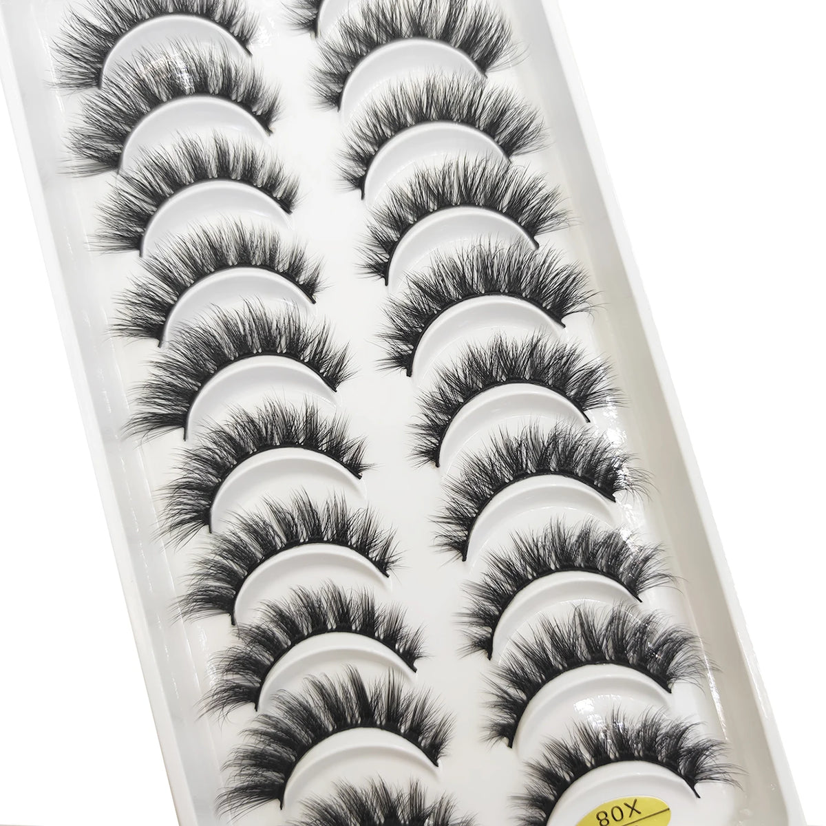 A plastic tray of natural mink false eyelashes in various styles and lengths.