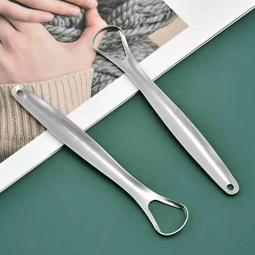 A stainless steel tongue scraper is shown next to a hand, demonstrating its use for oral hygiene.