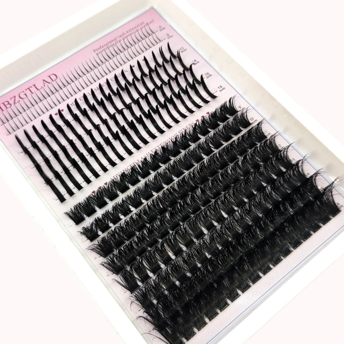A display of various black eyelash clusters and extensions for dramatic eye looks.