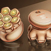A close-up view of a rose gold electric head shaver with floating cutter heads and an LED display.