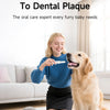 A young girl is using an ultrasonic dental cleaner on a dog while a small poodle sits nearby.