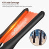 A close-up view of a black flat iron with an orange heating plate, showing water droplets on the surface.
