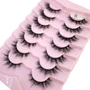 Plateau en plastique rose contenant divers styles de faux cils de renard noirs pour maquillage.