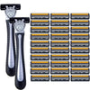 A set of stainless steel safety razors with replaceable triple-blade heads arranged in a grid.