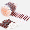 A bundle of instant iodine swabs with brown and white tips is shown in a close-up view.