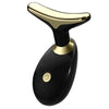 A black and gold electric facial lifting and firming massager device.