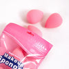 A pink cosmetic sponge product featuring six beauty eggs on a white background.