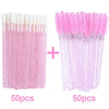 A set of 100 disposable pink eyelash and eyebrow brushes, divided into two groups of 50 pieces.