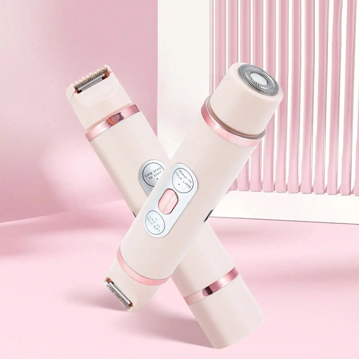 A pair of portable electric body hair trimmers in a light beige color are shown diagonally against a pink background.