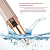 A close-up of a metallic hair removal tool with a detachable cutter head being washed under water.
