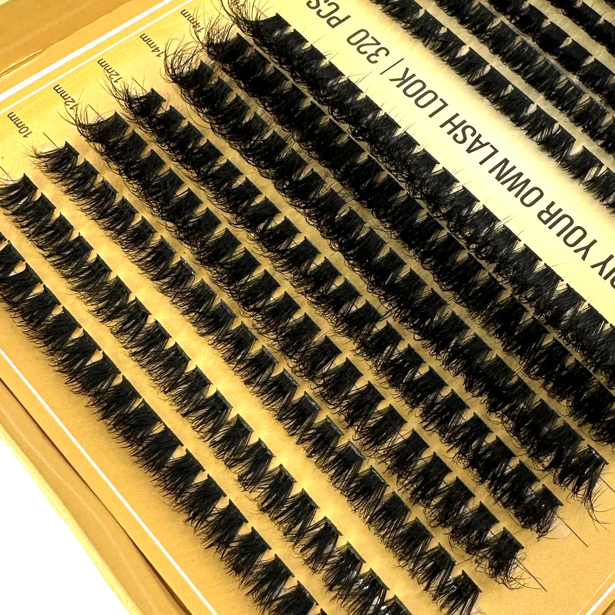 A box of volume lash clusters for DIY eyelash extensions, showing natural mink-feel lashes.