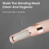 A close-up of a pink automatic electric foot grinder dispensing liquid onto a surface.