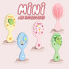 A set of four cartoon mini air cushion massage combs in yellow, pink, blue, and green.
