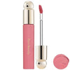A tube of liquid bronzer contour foundation stick in pink packaging with a brush applicator and a round product lid.