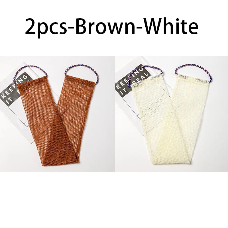 Two brown and white exfoliating body scrub sponges with purple loops shown against a white background.