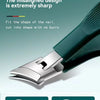 A close-up of a green nail clipper showing the sharp, misaligned design and cutting blades.