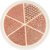 A circular tray of gold mixed stainless steel beads used for nail art decorations, divided into sections.