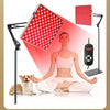 A woman sits in a lotus pose next to a dog, with a red light therapy panel and a handheld device visible.