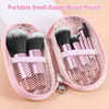 A pink zippered pouch containing a set of 10 makeup brushes and tools for travel.