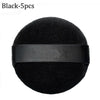 Black makeup puffs with a black elastic band shown from above
