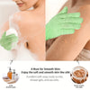 Green exfoliating bath gloves and sea salts used for smooth skin