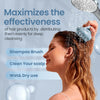 A woman is using a blue silicone shampoo brush to distribute hair products for deep cleansing.