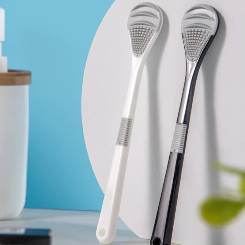 A pair of reusable metal tongue cleaner brushes displayed against a white background.
