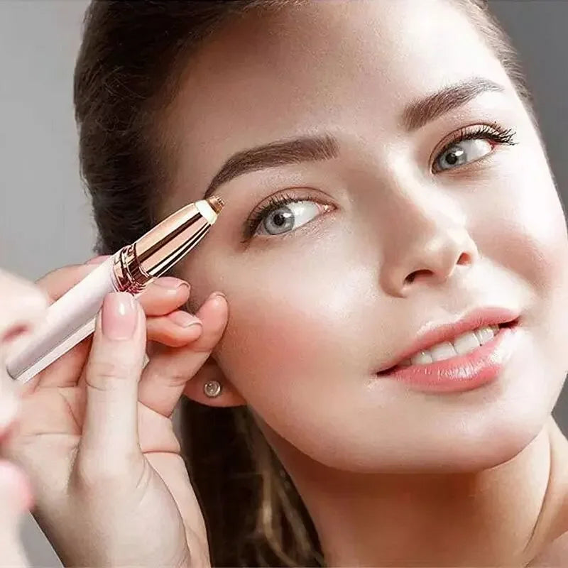 A woman is using an automatic electric eyebrow trimmer on her eye.